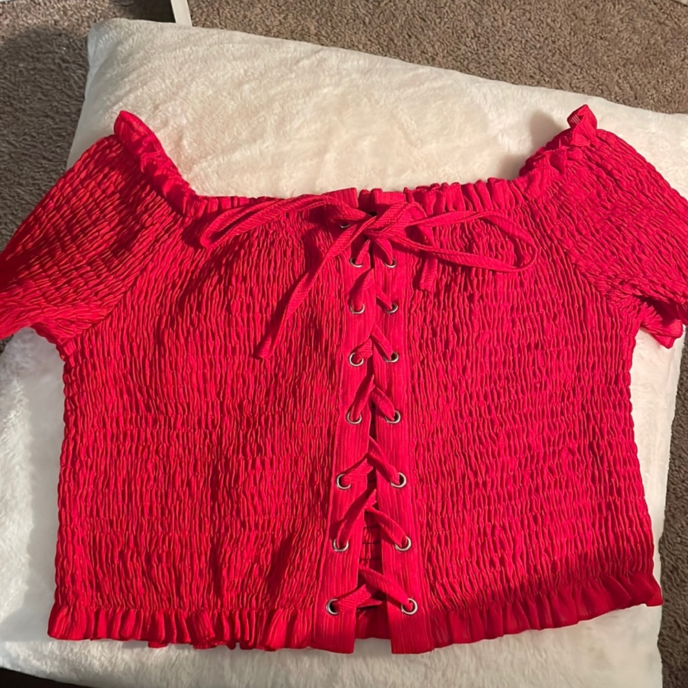 Red short sleeve shirt with lace up detail